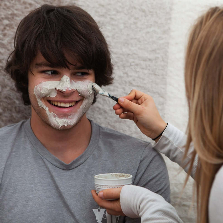 Emily putting the calming mask on Kevin&