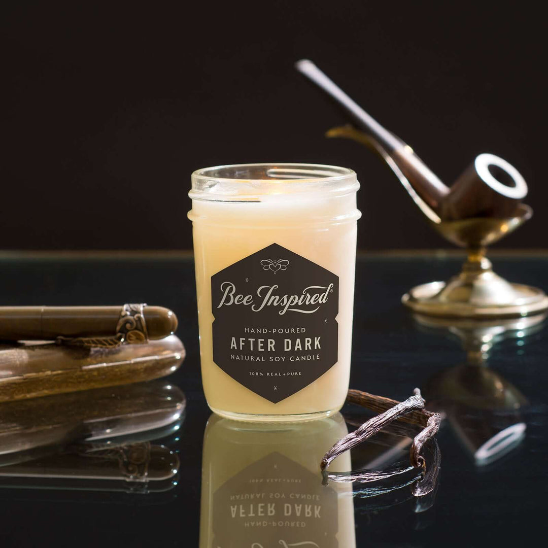 After Dark jelly jar candle on glass table with pipe 
