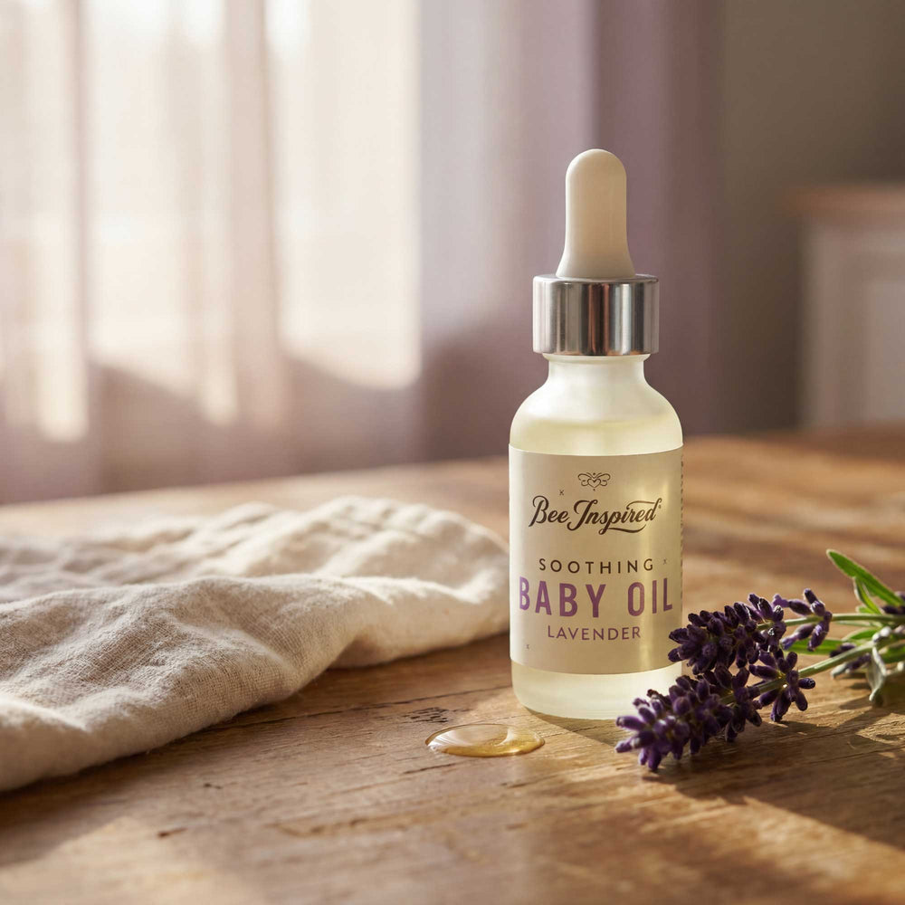 Bee Inspired soothing baby oil bottle with lavender on a wooden surface