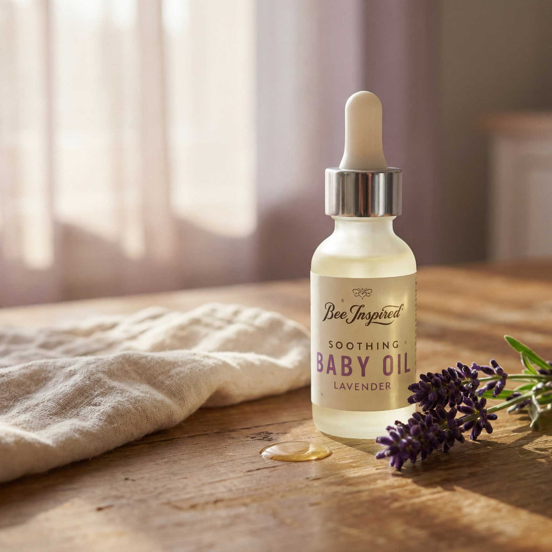 Bee Inspired soothing baby oil bottle with lavender on a wooden surface