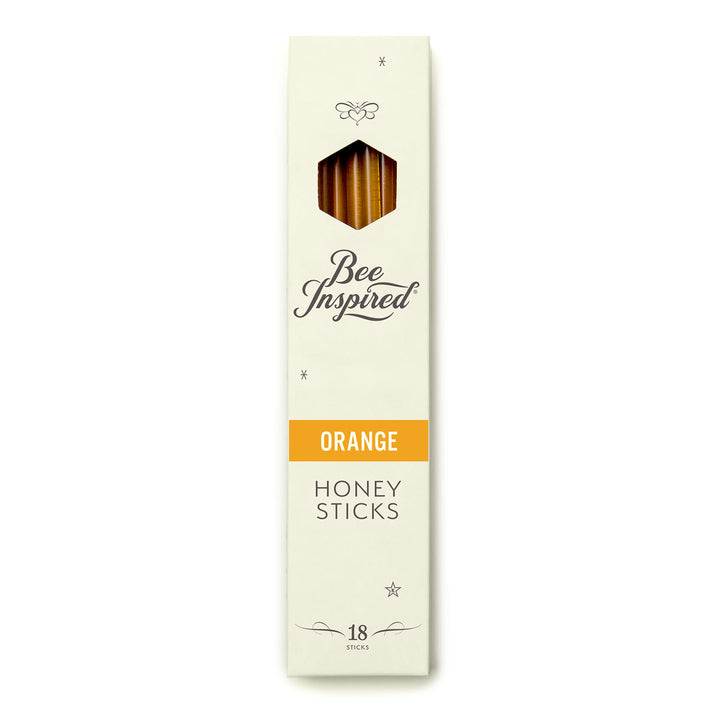 Box of Bee Inspired Orange Honey Sticks on a white background