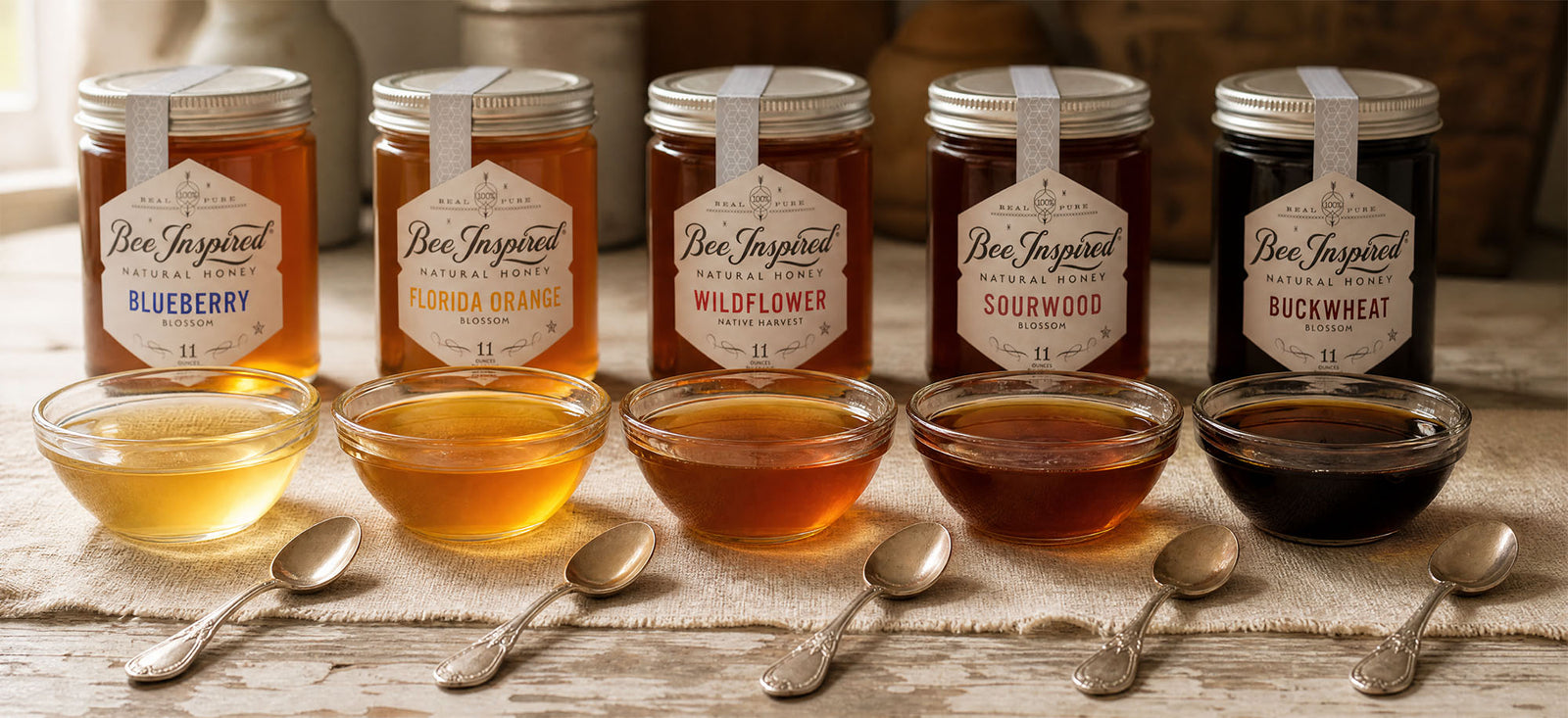 a flight of honey for tasting with spoons