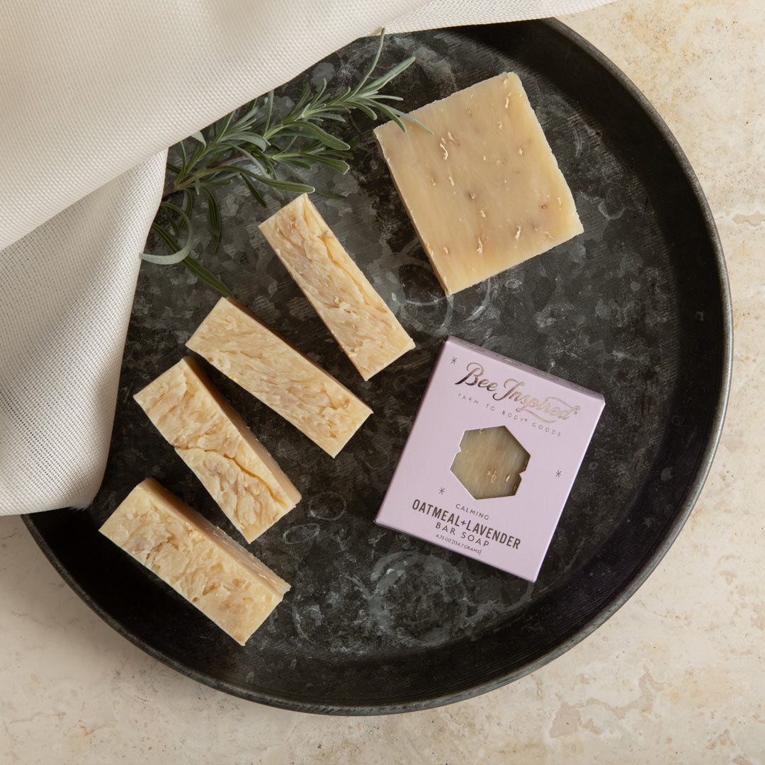bee inspired oatmeal + lavender bar soap on a tray