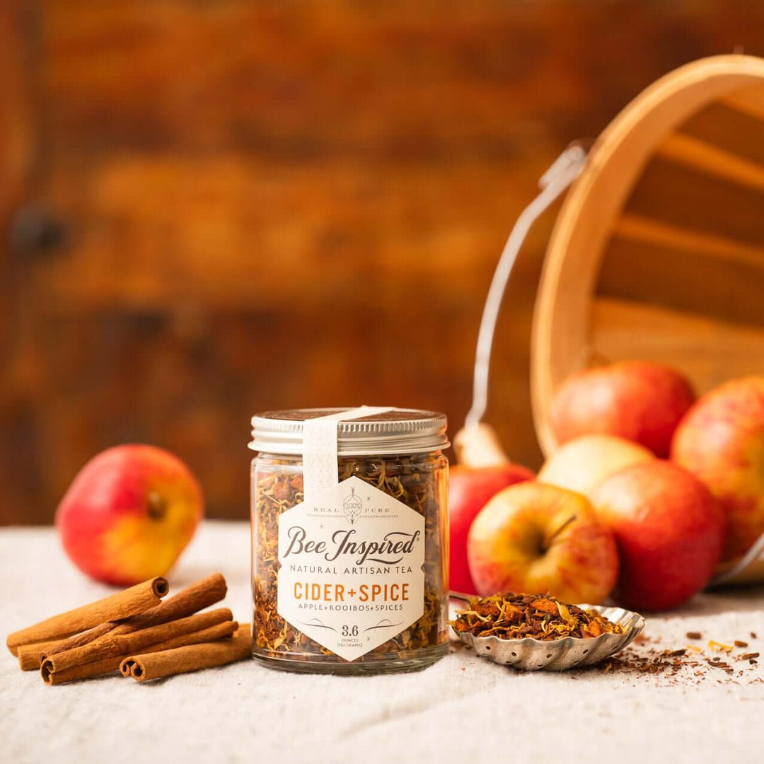 Cider and Spice Tea with cinnamon sticks and apples 