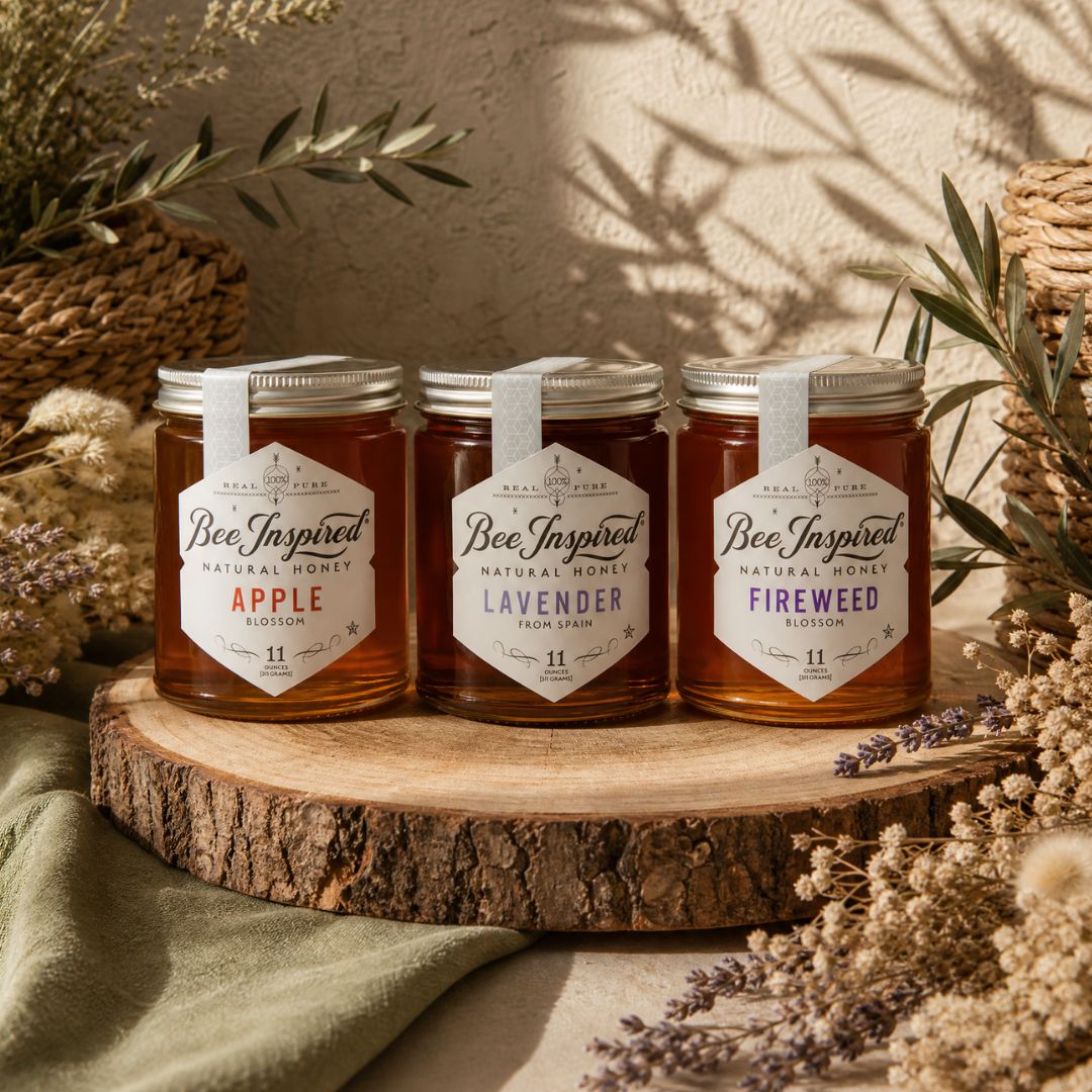 apple honey, lavender honey and fireweed honey on wood