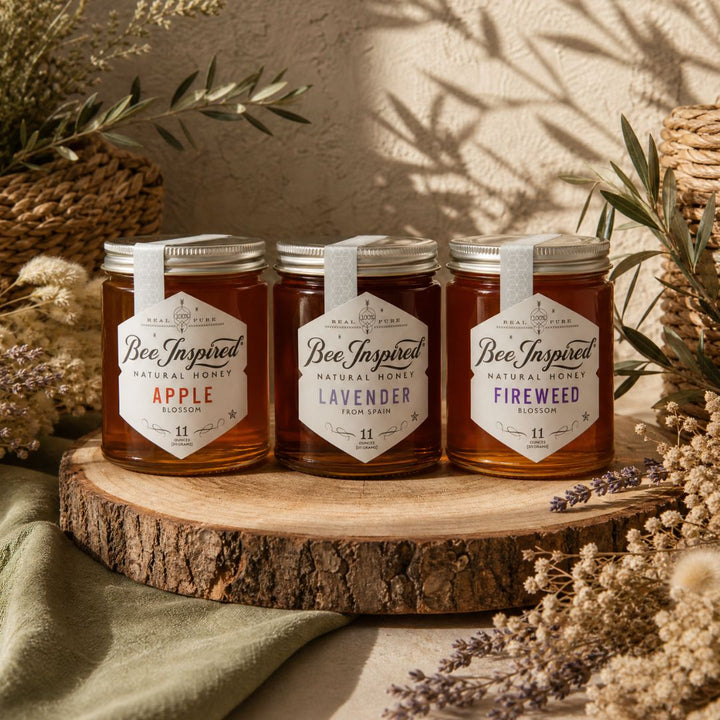 apple honey, lavender honey and fireweed honey on wood